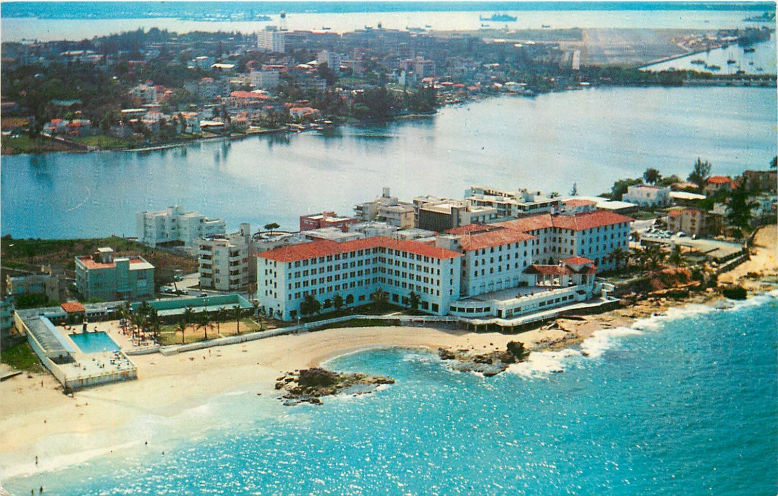 Aerial postcard view of Condado Beach Hotel area and the San Juan coastline with the Atlantic Ocean and Condado Lagoon visible